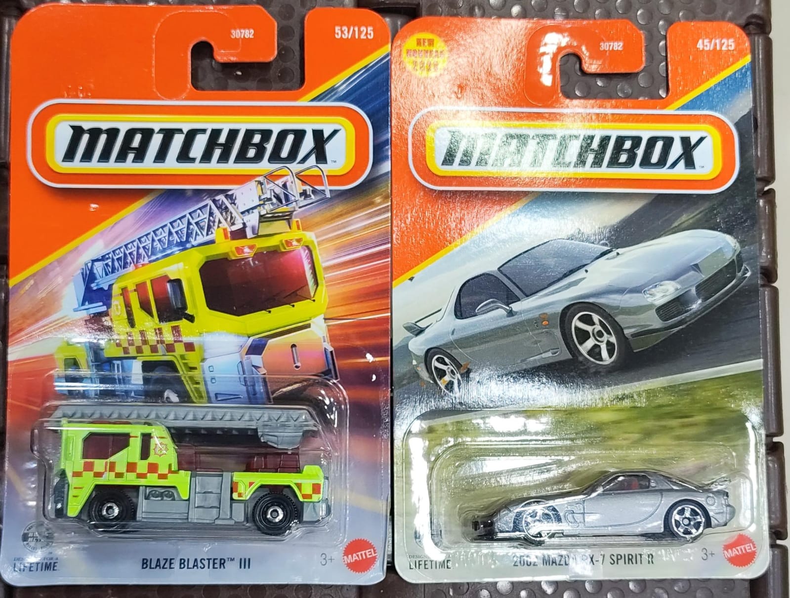 Matchbox Cars 2026 - Combo Pack of 2 Pcs - 2002 Mazda RX-7 Spirit R & Blaze Blaster III - 30782-95FG